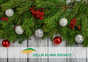 Das Logo der Klinik ist mit geschmückten Tannenzweigen verziert.